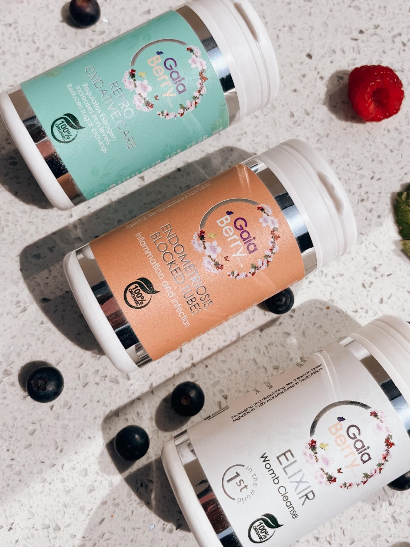 GaiaBerry remedies arranged with fresh berries